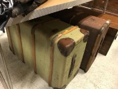 Two canvas and strapwork bound trunks of typical form,