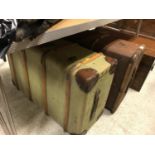 Two canvas and strapwork bound trunks of typical form,