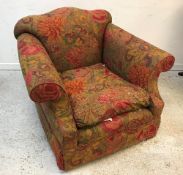 A Sinclair Melsom Designs Ltd scroll arm chair in floral print upholstery raised on square tapered