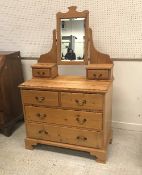 A pitch pine dressing chest in the Victorian manner with mirrored super structure over two short
