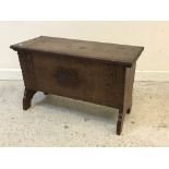 An oak coffer of small proportions in the Arts & Crafts manner,
