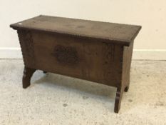 An oak coffer of small proportions in the Arts & Crafts manner,