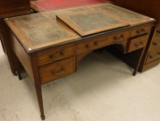 An Edwardian mahogany and rosewood strung and ebonised writing table,