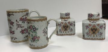 A pair of Samson of Paris Chinese armorial tea caddies and covers,