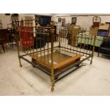 A Victorian lacquered brass framed double bedstead in the manner of James Shoolbred of Tottenham
