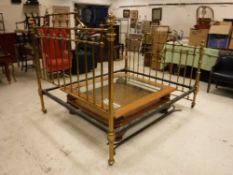 A Victorian lacquered brass framed double bedstead in the manner of James Shoolbred of Tottenham