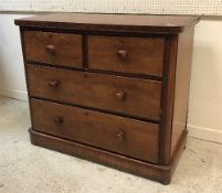 A Victorian mahogany chest of two short over two long drawers with turned knob handles 106 cm wide