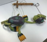 A Pelham Puppet sea monster puppet together with three Wupper Airlines puppets,