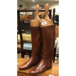 A pair of brown leather riding boots with wooden trees CONDITION REPORTS The size of