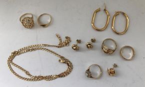 A collection of various 9 carat gold jewellery including wedding band, opal ring,