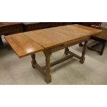 An early 20th Century oak draw leaf dining table,
