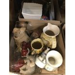 Three boxes of assorted sundry items to include various decorative tins, vintage tennis rackets,