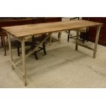 A 20th Century pine and painted folding trestle table 182 cm x 64.4 cm x 75.