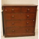 A Victorian stained pine chest of two short over three long graduated drawers on squat bun feet 113