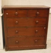 A Victorian stained pine chest of two short over three long graduated drawers on squat bun feet 113