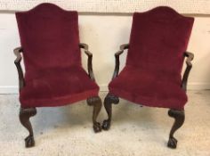 A pair of early 20th Century mahogany framed elbow chairs in the George III taste,