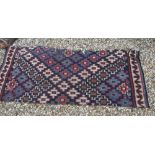 A collection of four various caucasian rugs, one Kelim style heart rug,
