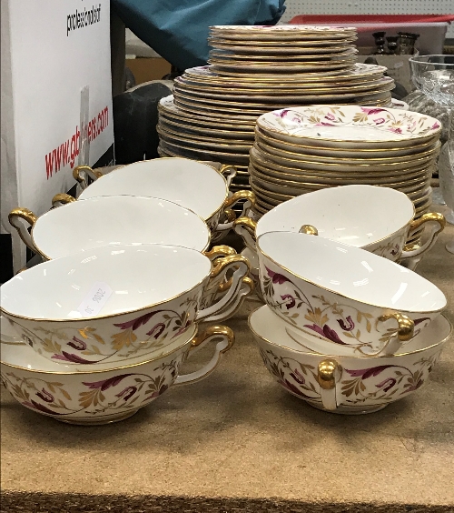 A Royal Crown Derby "Princess" (A1281) pattern part dinner service in puce and gilt foliate design