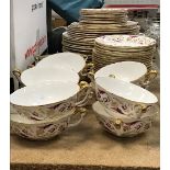 A Royal Crown Derby "Princess" (A1281) pattern part dinner service in puce and gilt foliate design