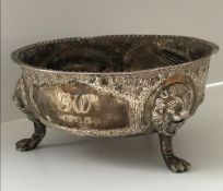 A George V silver bowl with embossed decoration depicting fox,