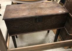 An 18th Century and later carved oak box on stand,