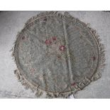 Two Kashmir rugs with central floral spray medallions on a pale green ground,