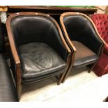 A pair of circa 1900 mahogany and leather upholstered and studded tub chairs on square moulded