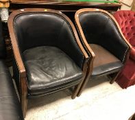 A pair of circa 1900 mahogany and leather upholstered and studded tub chairs on square moulded