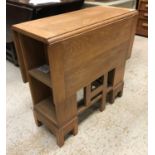An oak rectangular drop leaf table in the Cotswold school manner,