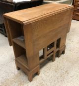 An oak rectangular drop leaf table in the Cotswold school manner,