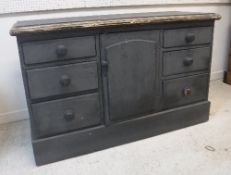 A Victorian painted pine enclosed dresser with central cupboard door flanked by two banks of three