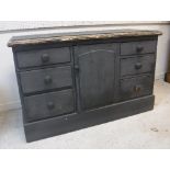 A Victorian painted pine enclosed dresser with central cupboard door flanked by two banks of three