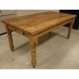 A 20th Century pine farmhouse style kitchen table in the Victorian manner,
