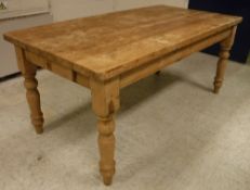 A 20th Century pine farmhouse style kitchen table in the Victorian manner,