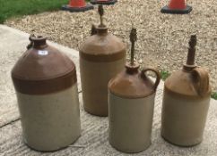 A collection of four stone cider flagons mounted as table lamps