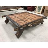 An Indian teak and iron bound camel sledge table of typical form,
