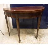 An Edwardian mahogany and satinwood strung fold over card table in the Regency style,