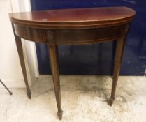 An Edwardian mahogany and satinwood strung fold over card table in the Regency style,