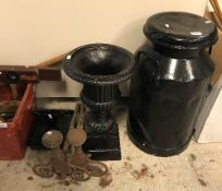 A black painted milk churn, approx 67 cm high, a black painted cast iron urn,