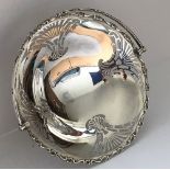 A George V silver and pierced fruit basket with swing handle (by Martin Hall & Co, Sheffield 1921),