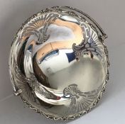 A George V silver and pierced fruit basket with swing handle (by Martin Hall & Co, Sheffield 1921),