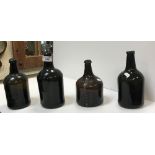 Four 19th Century wine bottles of various shapes and sizes,