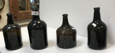 Four 19th Century wine bottles of various shapes and sizes,