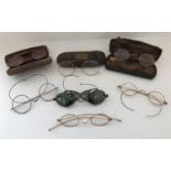 A collection of 19th Century and later spectacles to include gold examples and a tinted pair with