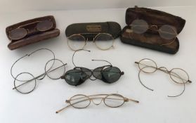 A collection of 19th Century and later spectacles to include gold examples and a tinted pair with