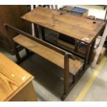 A 19th Century French fruitwood double school desk with integral bench seat 110 cm wide x 78 cm