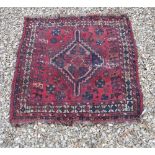 A Shiraz cushion, approx 116 cm, together with a rug,