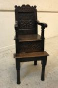 A 17th Century child's oak highchair,