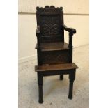 A 17th Century child's oak highchair,