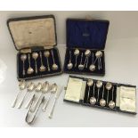 A cased set of six silver coffee bean spoons, a cased set of six silver Apostle spoons,